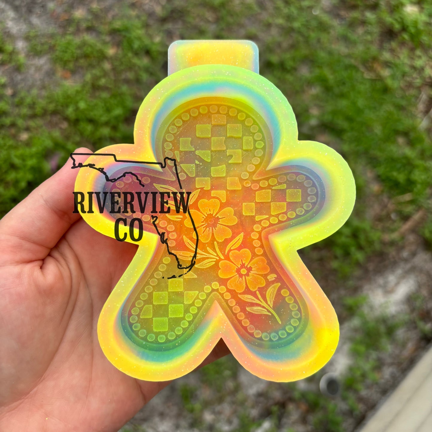 Checkered gingerbread man with tooled leather flowers car freshie mold