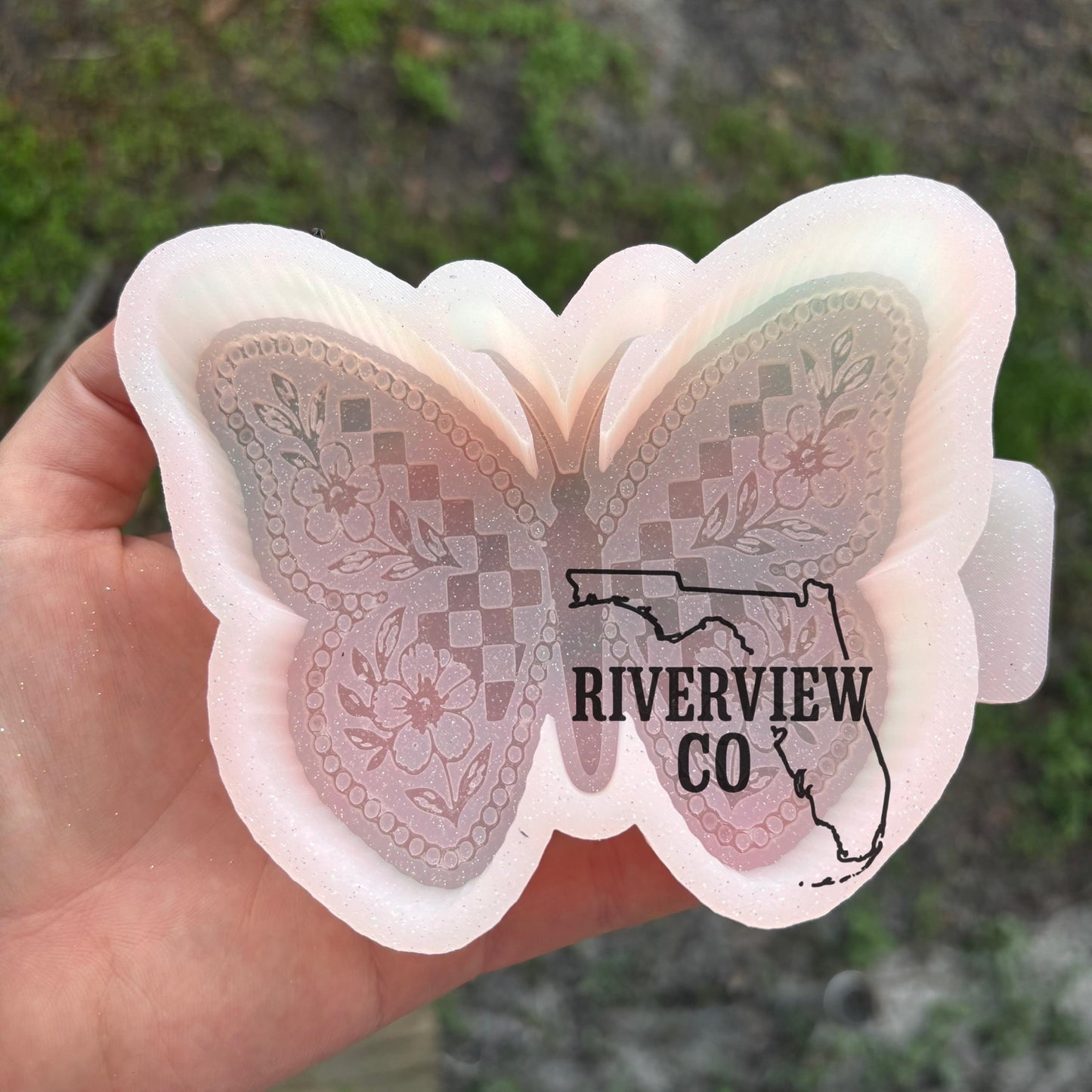 Checkered butterfly with flower tooled leather car freshie mold